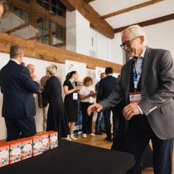 People giving and receiving gifts in a banquet hall