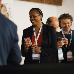 People giving and receiving gifts in a banquet hall