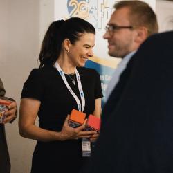 People giving and receiving gifts in a banquet hall