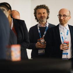 People giving and receiving gifts in a banquet hall