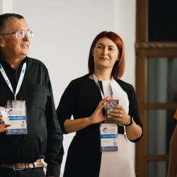 People giving and receiving gifts in a banquet hall
