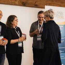 People giving and receiving gifts in a banquet hall