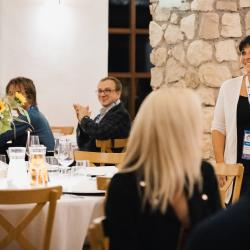 People sitting at the tables in a banquet hall