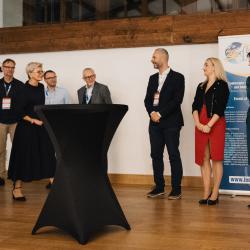 People on stage in a banquet hall