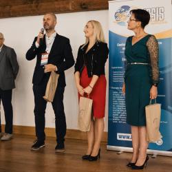 People on stage in a banquet hall