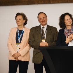People on stage in a banquet hall