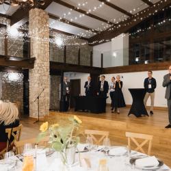 People on stage in a banquet hall