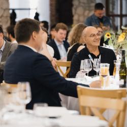 People sitting at the tables in a banquet hall