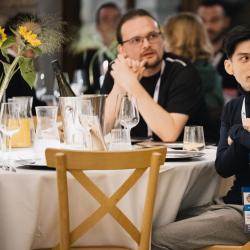 People sitting at the tables in a banquet hall